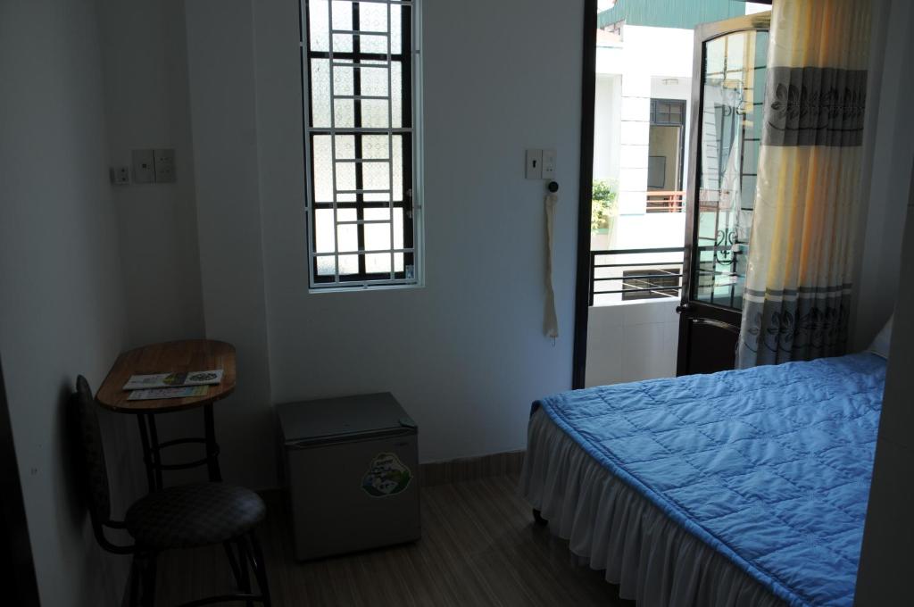 Postel nebo postele na pokoji v ubytování Bien Khoi Mini Hotel