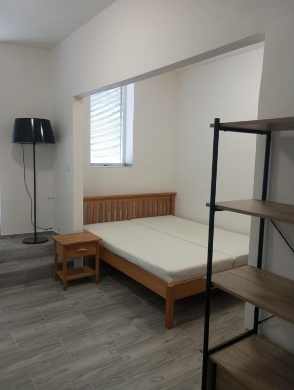Postel nebo postele na pokoji v ubytování UbytkoMácháč