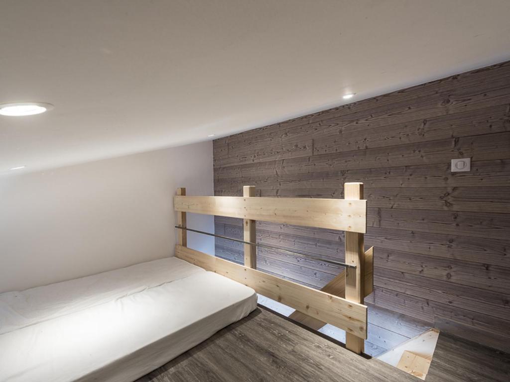 Posteľ alebo postele v izbe v ubytovaní Duplex rénové, skis aux pieds, balcon, proche commerces, 8 pers, animaux acceptés - FR-1-502-466