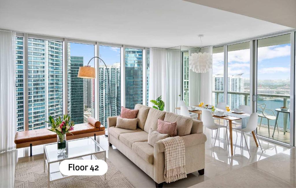 a living room with a couch and a table at MVR - Designer Condo in Prime Brickell in Miami