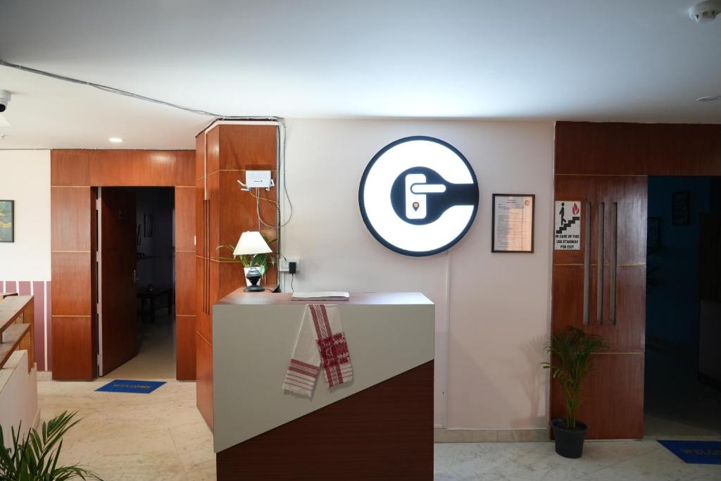an office with a logo on a wall at Casa Felice Stays in Guwahati
