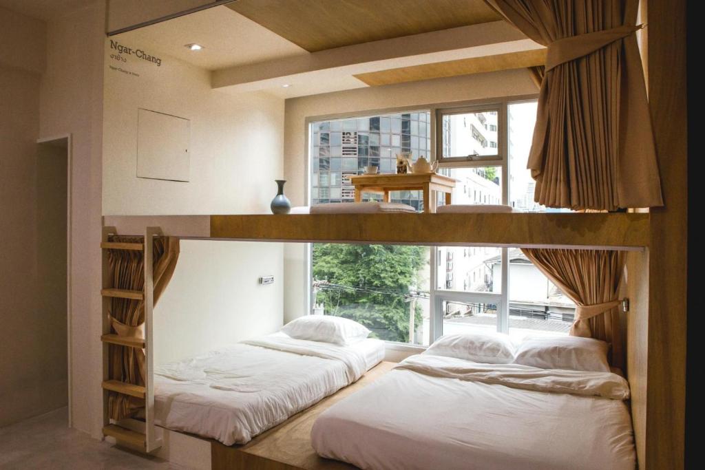 Postel nebo postele na pokoji v ubytování BoB Hostel บ็อบโฮสเทล