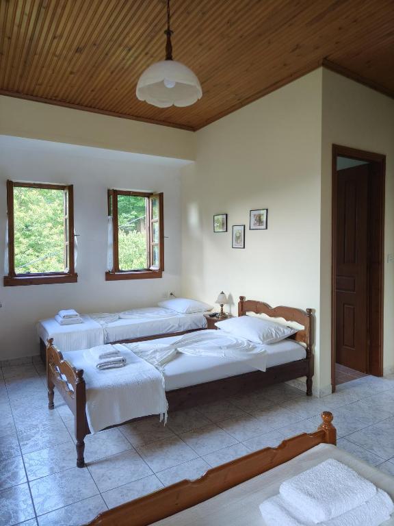 Postel nebo postele na pokoji v ubytování Filoxenia