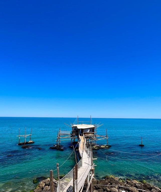 a boat in the water next to the ocean at Apartment in Marina di San Vito Chietino in Marina San Vito