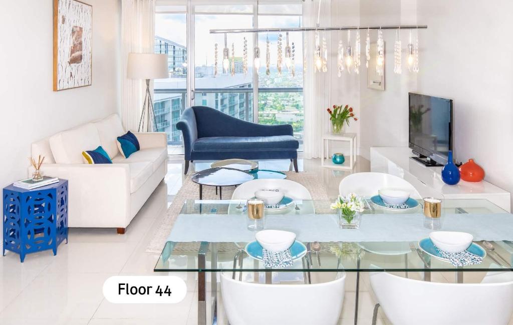 a living room with a couch and a table at MVR Luxury Condo High Floor European Design in Miami