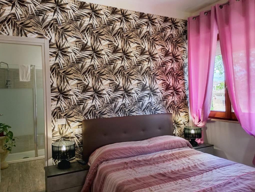 Postel nebo postele na pokoji v ubytování FalcoBianco GuestHouse