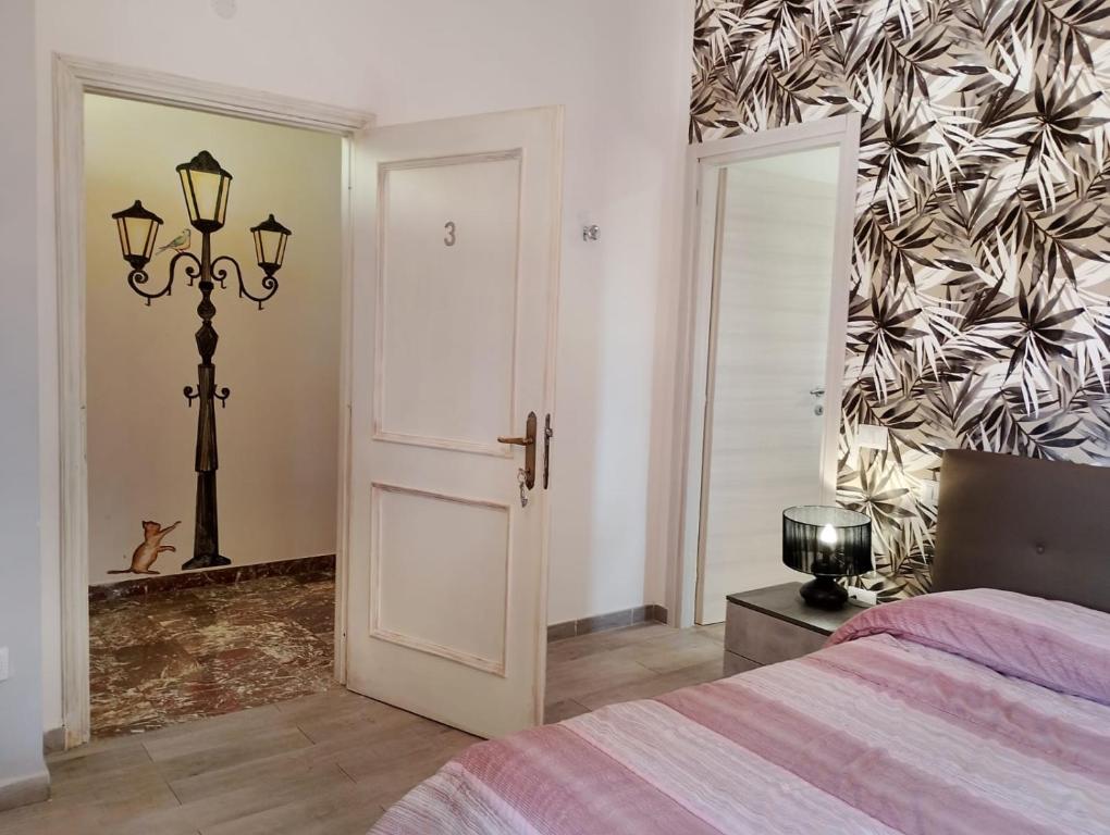 Postel nebo postele na pokoji v ubytování FalcoBianco GuestHouse