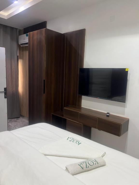 Ένα ή περισσότερα κρεβάτια σε δωμάτιο στο Koza Park Apartment