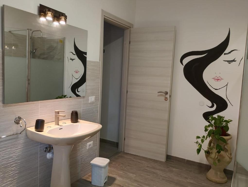Koupelna v ubytování FalcoBianco GuestHouse