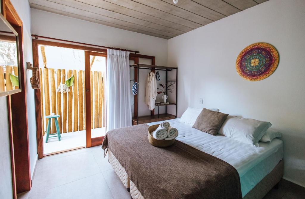 Cama ou camas em um quarto em Smart Hotel Reserva Ilhabela