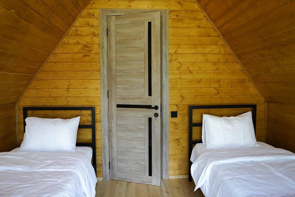 Postel nebo postele na pokoji v ubytování Tuta Area Cottage