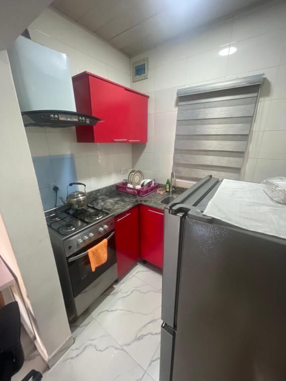 Kuchyň nebo kuchyňský kout v ubytování Easyinn Shortlet Apartment