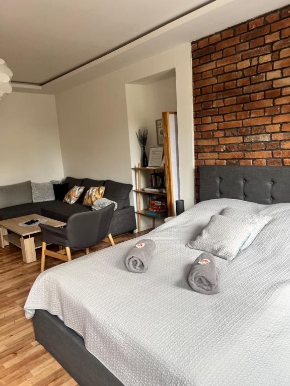Posteľ alebo postele v izbe v ubytovaní Apartament Pogodny