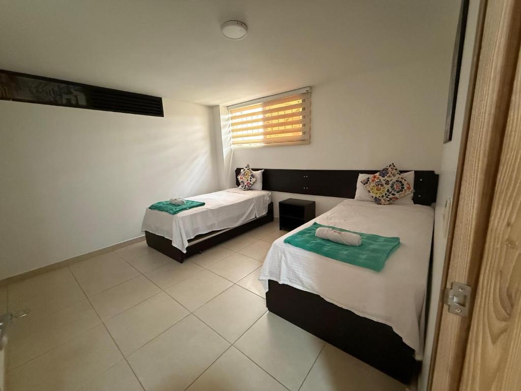 Postel nebo postele na pokoji v ubytování Aptahotel Guest House