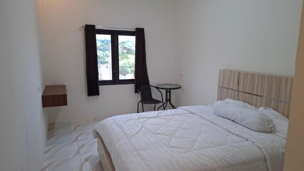 Postel nebo postele na pokoji v ubytování Homestay Sa'adah