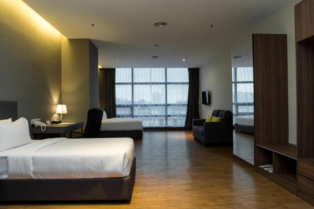 Postel nebo postele na pokoji v ubytování Imperial Regency Suites & Kuala Lumpur