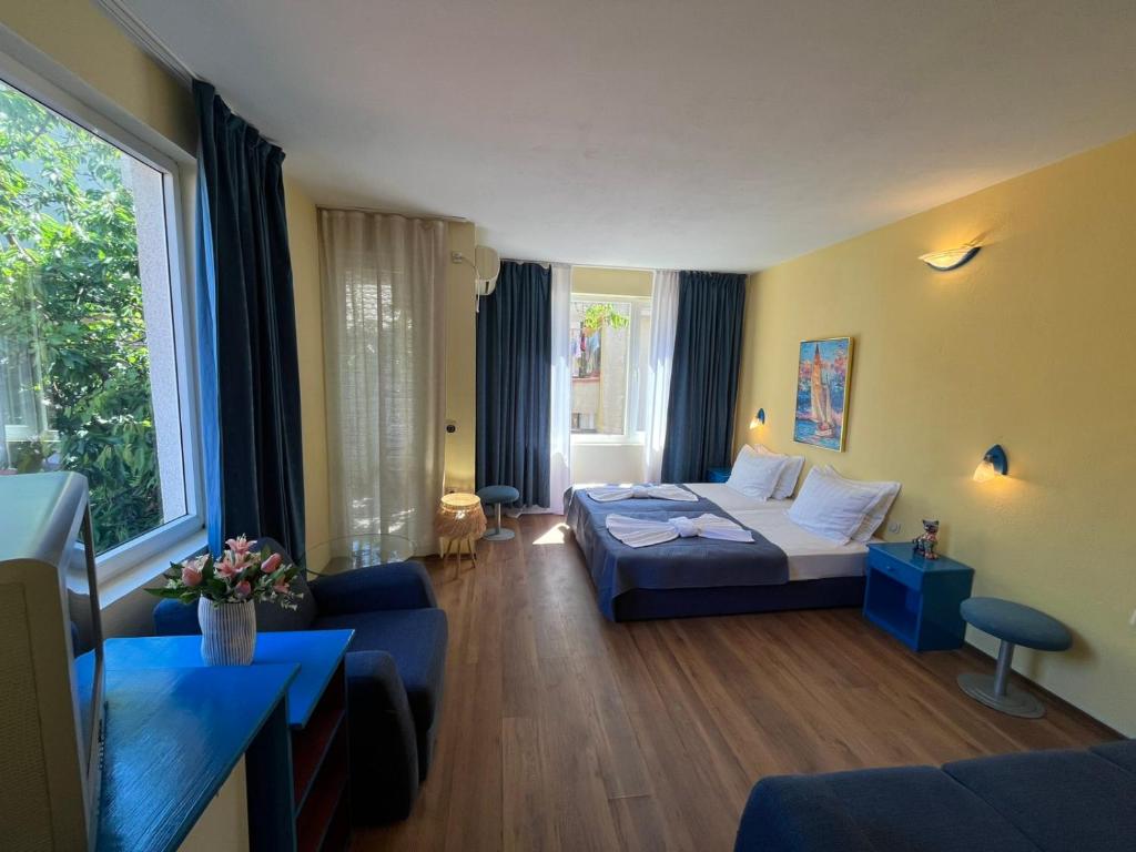 Postel nebo postele na pokoji v ubytování Hotel NEMO