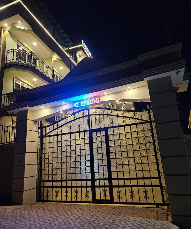 a building with a gate in front of it at night at Efrona Vacation Homes & Suites in Kampala