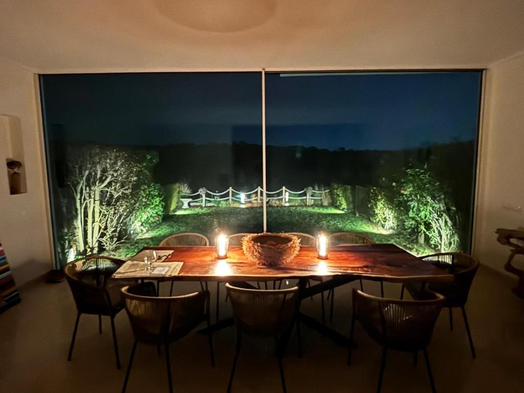 a dining room with a table with candles on it at Formosa Villas in Quinta do Lago