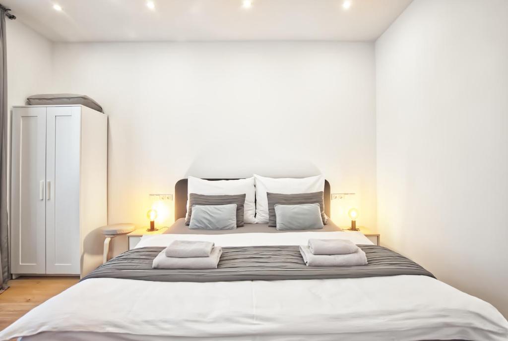 Postel nebo postele na pokoji v ubytování Apartmány VIENNA