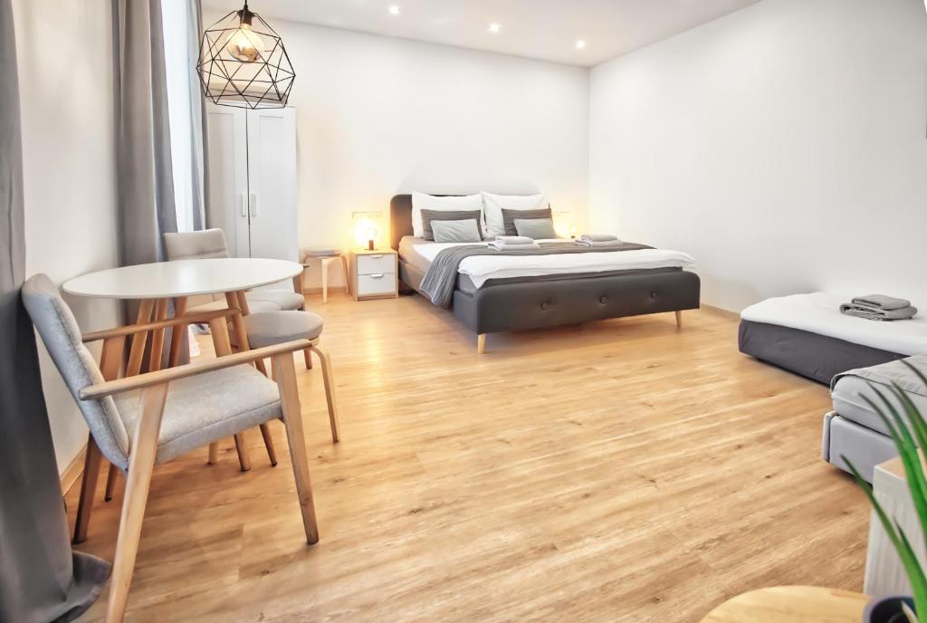 Postel nebo postele na pokoji v ubytování Apartmány VIENNA