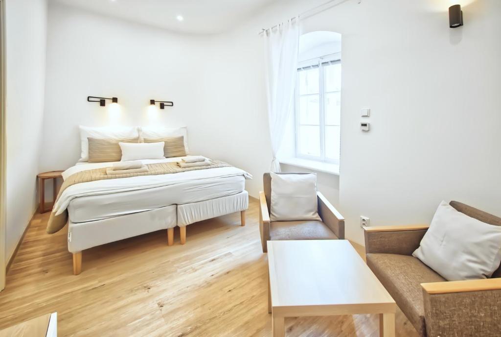 Postel nebo postele na pokoji v ubytování Apartmány VIENNA