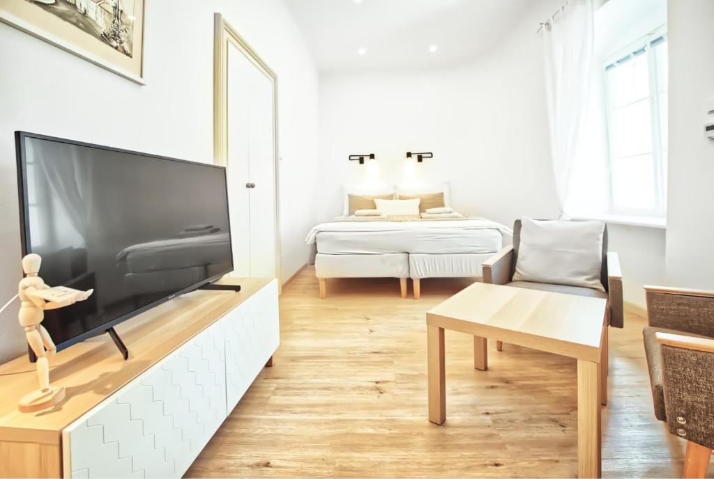 Postel nebo postele na pokoji v ubytování Apartmány VIENNA
