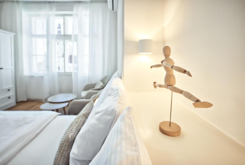 Postel nebo postele na pokoji v ubytování Apartmány VIENNA