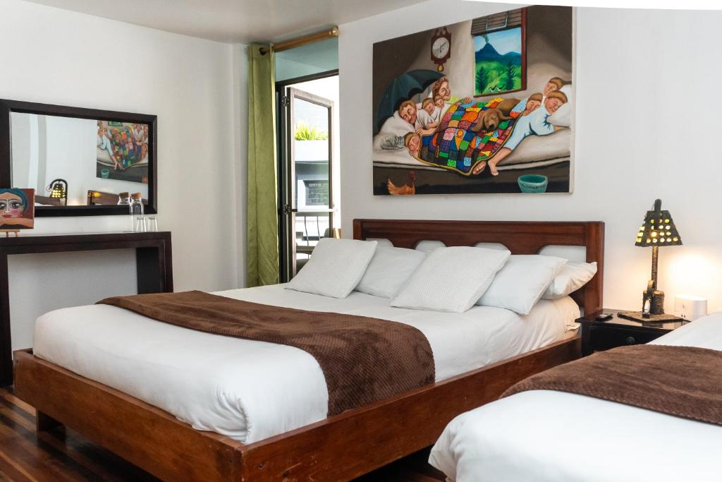Postel nebo postele na pokoji v ubytování Hotel De Mi Pueblo