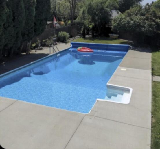 a blue swimming pool with a frisbee in it at Private SweetSuite 1 Bdrm Bathroom mini-kitchen in Kamloops