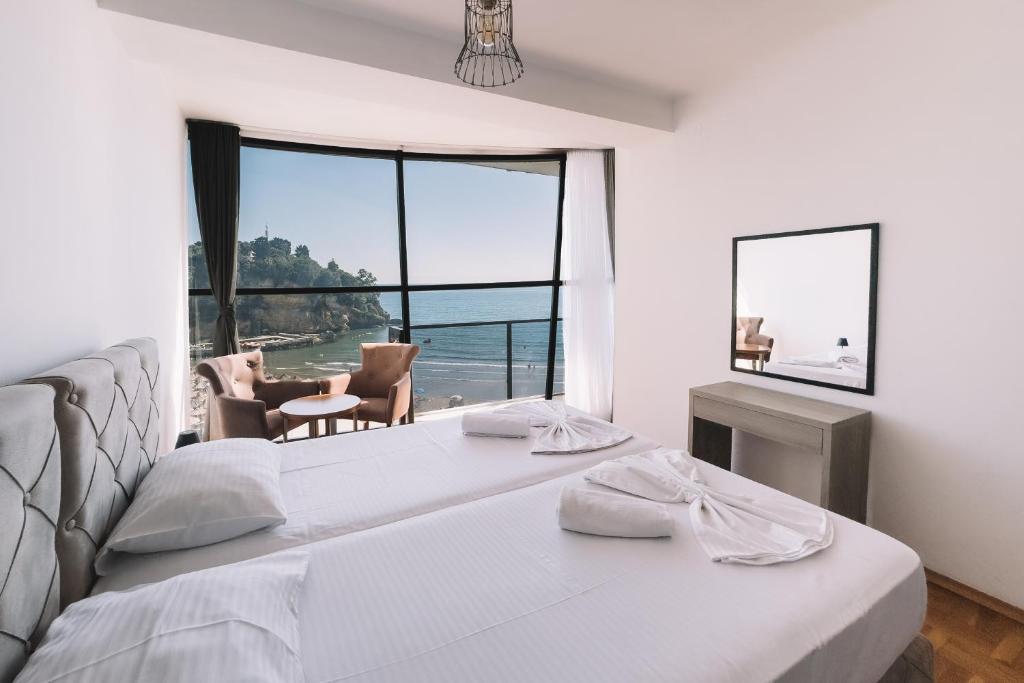 Postel nebo postele na pokoji v ubytování ApartHotel Cruiser Luxury