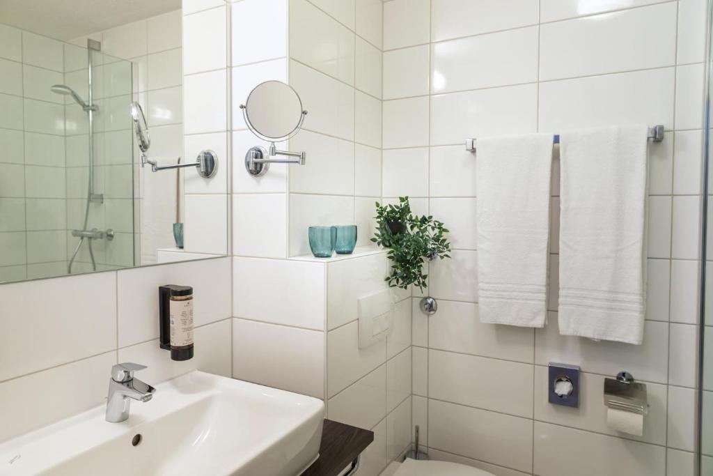 Koupelna v ubytování ACHAT Hotel Schwetzingen Heidelberg