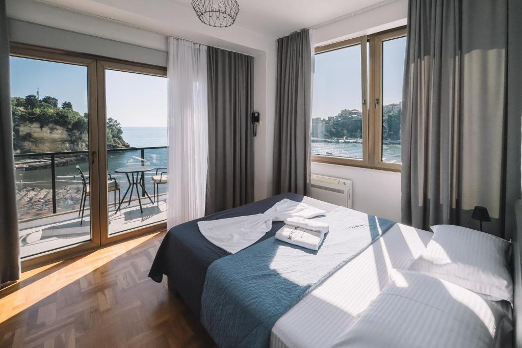 Postel nebo postele na pokoji v ubytování ApartHotel Cruiser Luxury