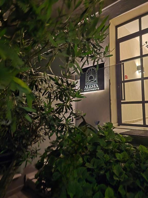 a sign on the side of a building with a window at Alesta Apartments in Stavros