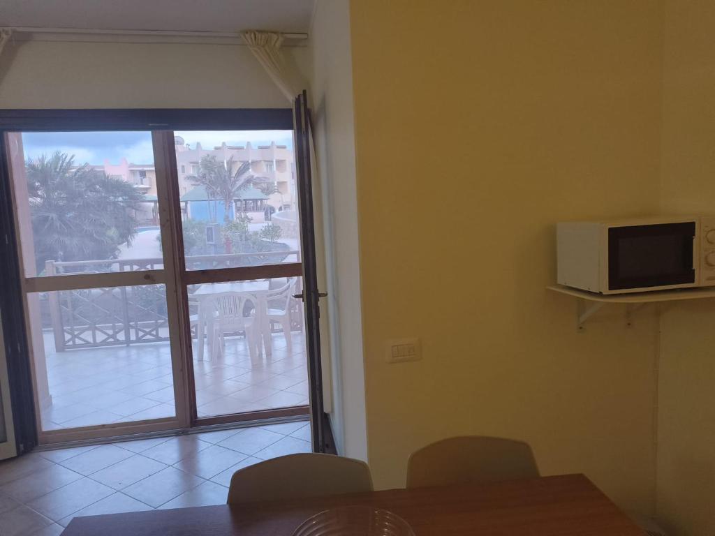 TV a/nebo společenská místnost v ubytování Marialva Tropical T2