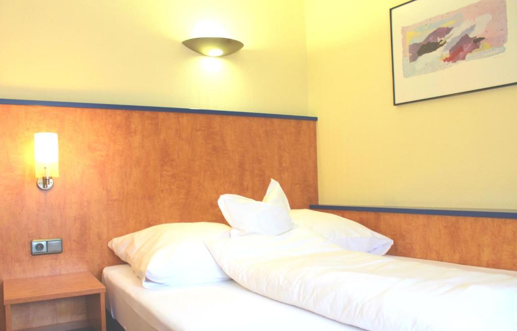 Postel nebo postele na pokoji v ubytování Hotel Ostmeier