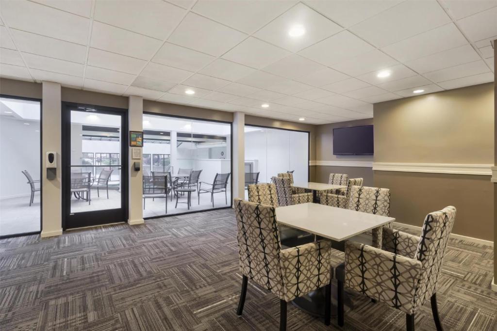 a conference room with a table and chairs at Best Western Seattle Airport Hotel in SeaTac