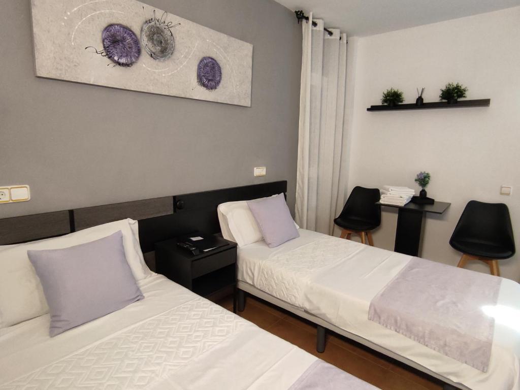 Postel nebo postele na pokoji v ubytování Hostal Turbon