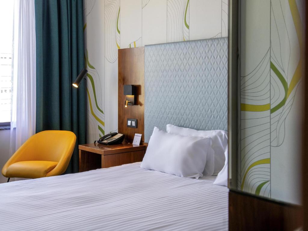 Postel nebo postele na pokoji v ubytování Mercure Antwerp City Centre