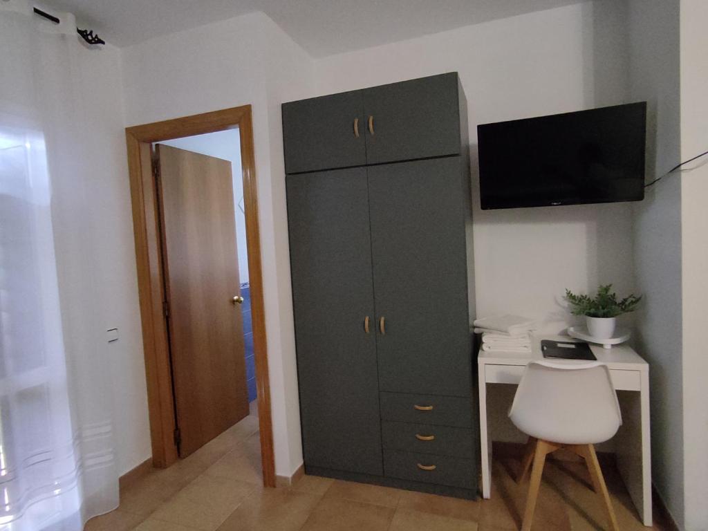 TV a/nebo společenská místnost v ubytování Hostal Turbon
