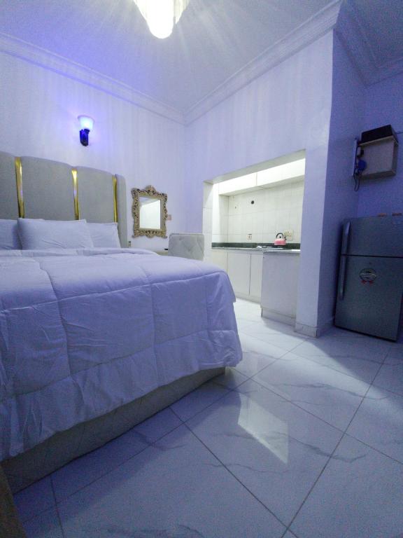 Postel nebo postele na pokoji v ubytování REGNO Apartment