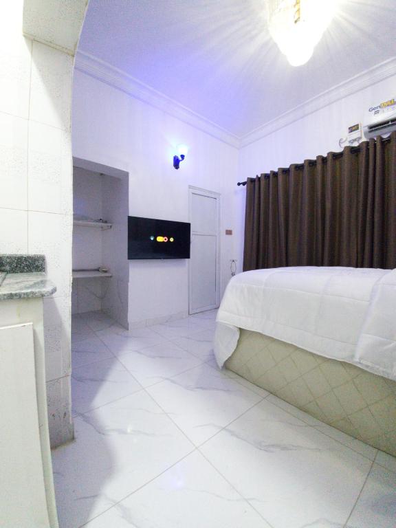 Postel nebo postele na pokoji v ubytování REGNO Apartment