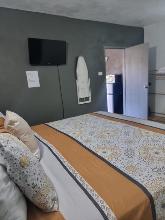 Postel nebo postele na pokoji v ubytování Cattleya Flor Hotel