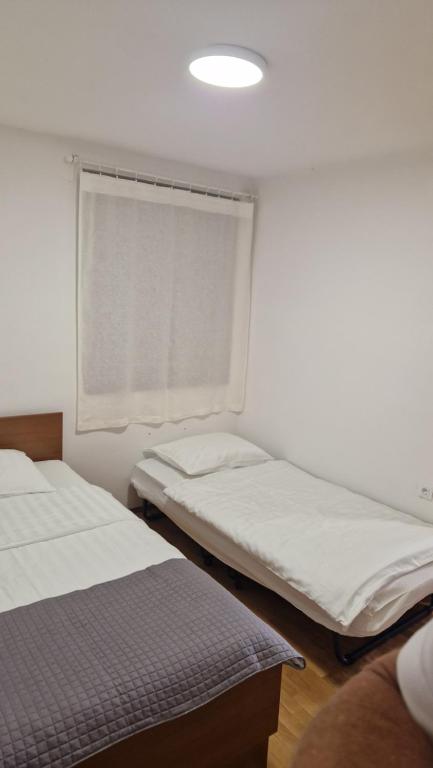 Postel nebo postele na pokoji v ubytování Apartmaji Z Fizine