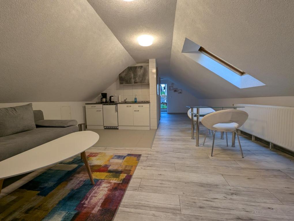 a living room with a couch and a table at Appartement am Bach in Bad Berneck im Fichtelgebirge
