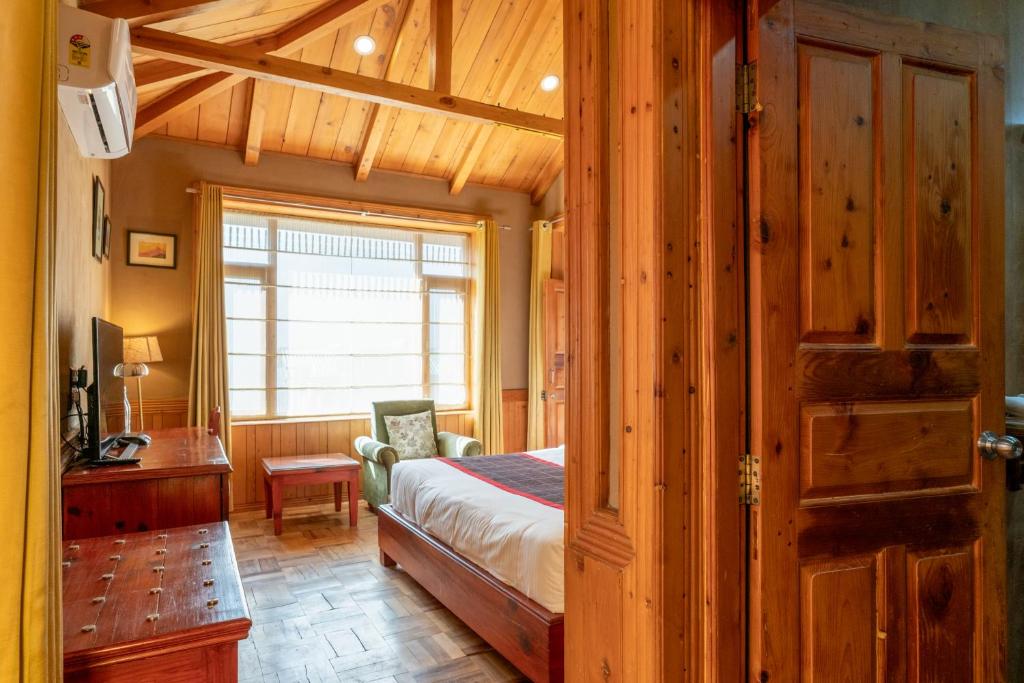 Postel nebo postele na pokoji v ubytování Shivadya - A Luxury Boutique Experience