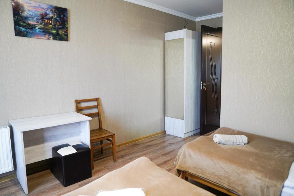 Postel nebo postele na pokoji v ubytování Hotel Elia Kazbegi