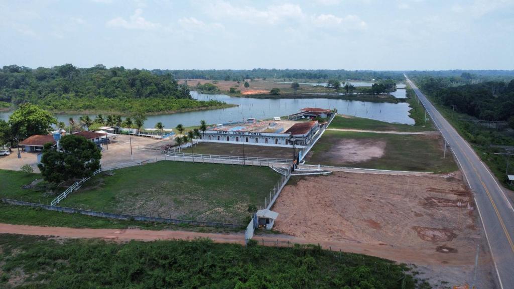 an aerial view of a building next to a river at Hotel Torre Forte in Careiro