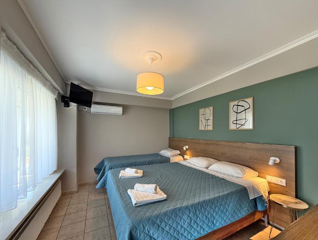 Postel nebo postele na pokoji v ubytování Hotel Thermaikos