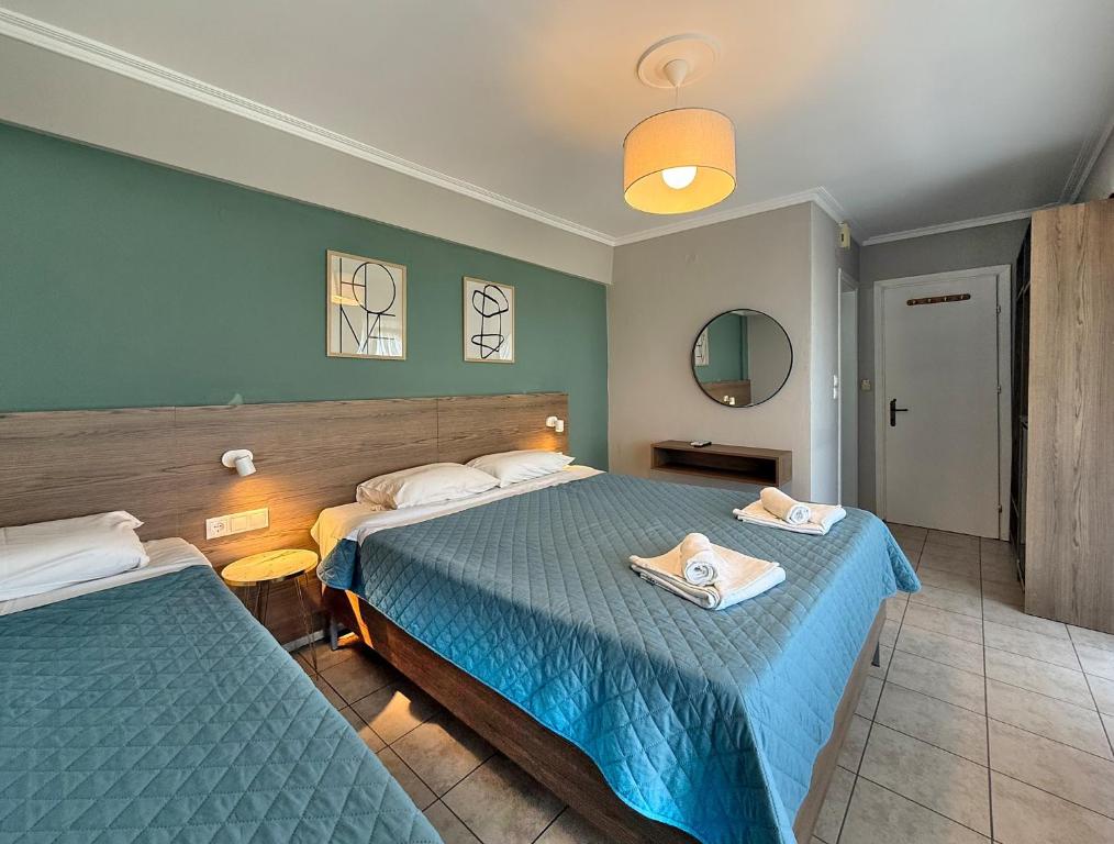 Postel nebo postele na pokoji v ubytování Hotel Thermaikos